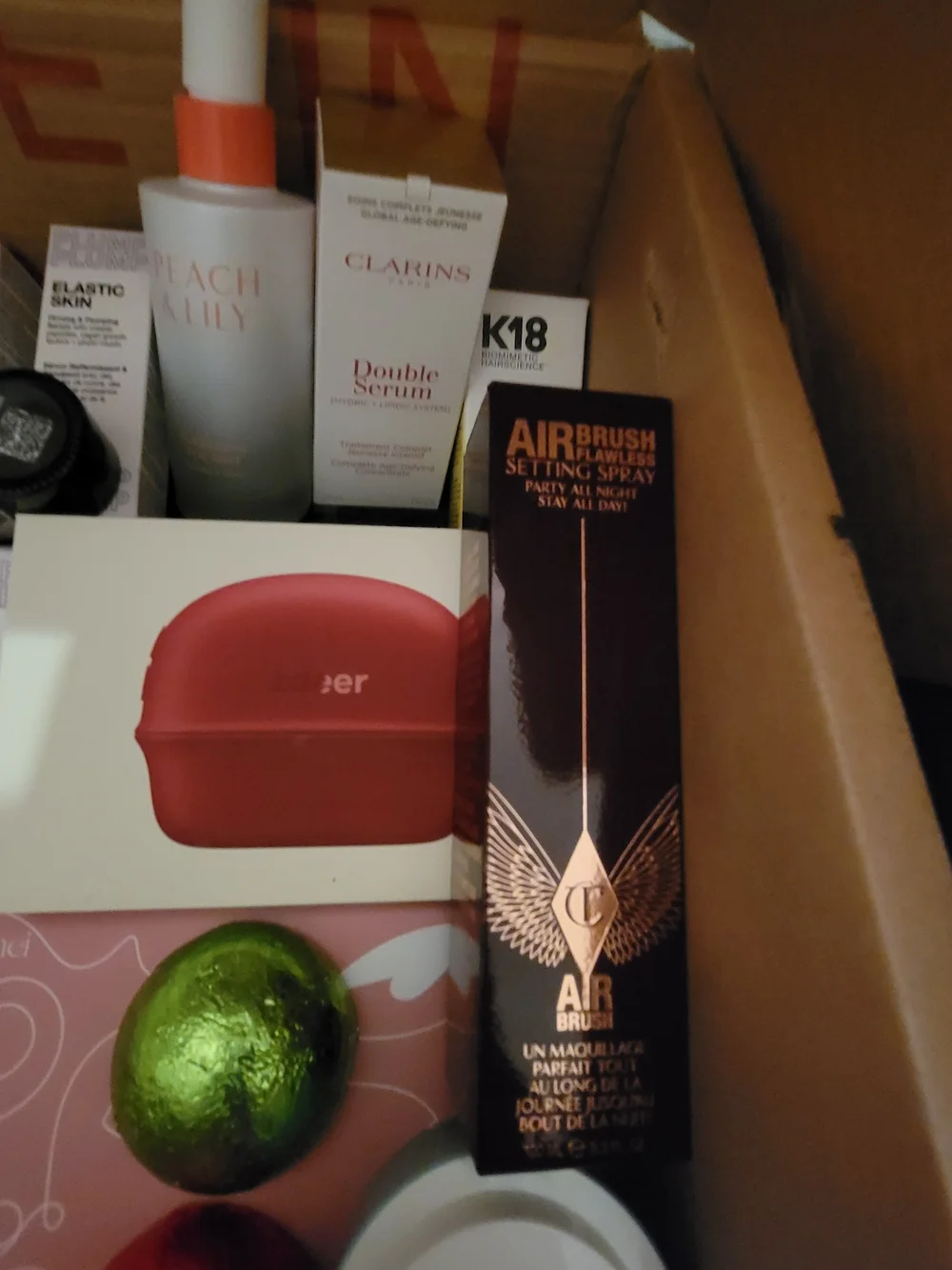 A Box Full Of Many High End Facial Items & Women's 8 Piece White Makeup Brushes